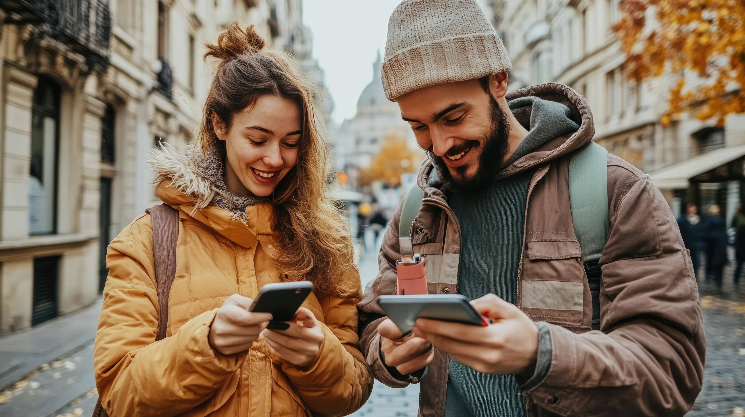 couple are looking at the phone and tablet